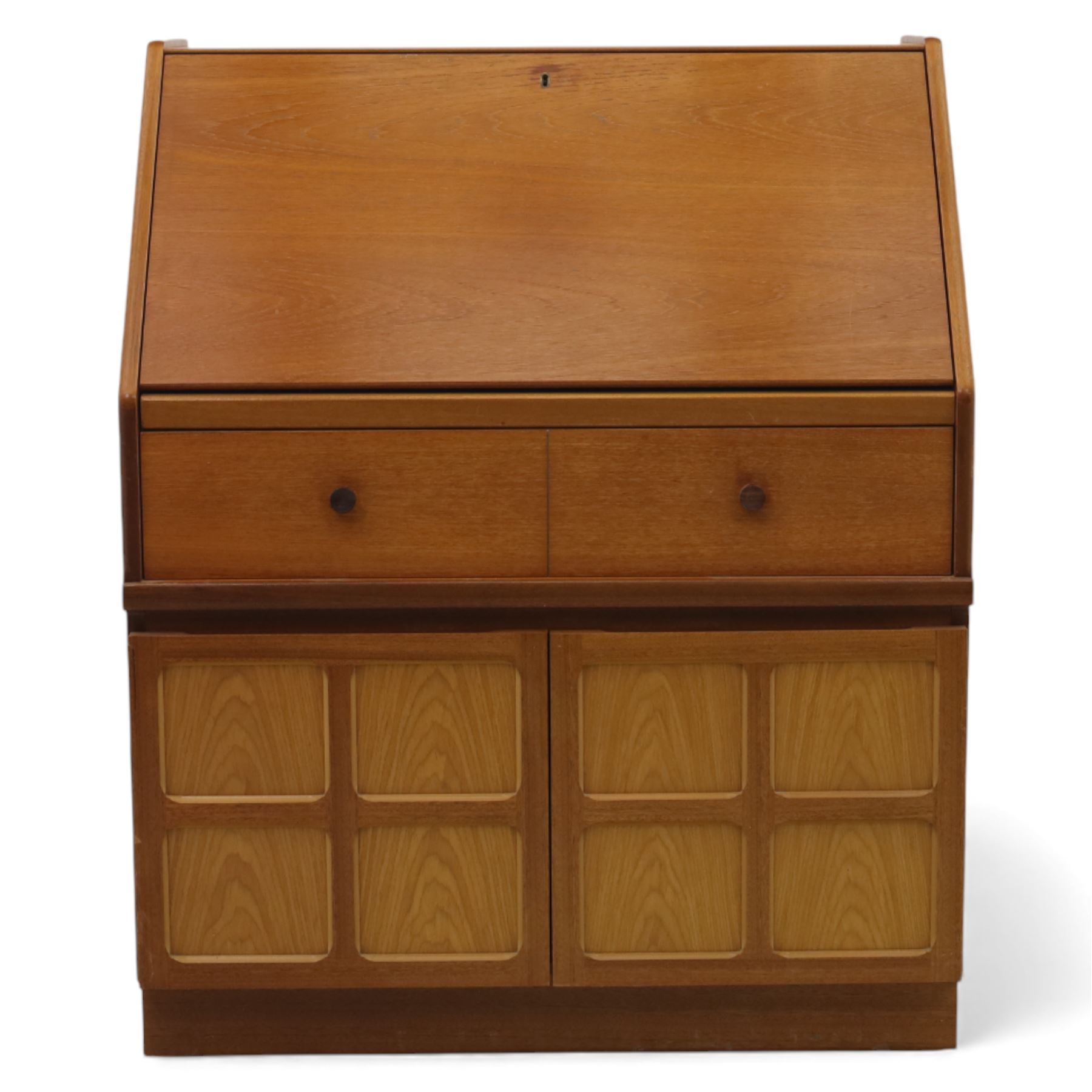 Parker Knoll - teak bureau, sloped fall front enclosing fitted interior, over two short drawers and two panelled cupboard doors