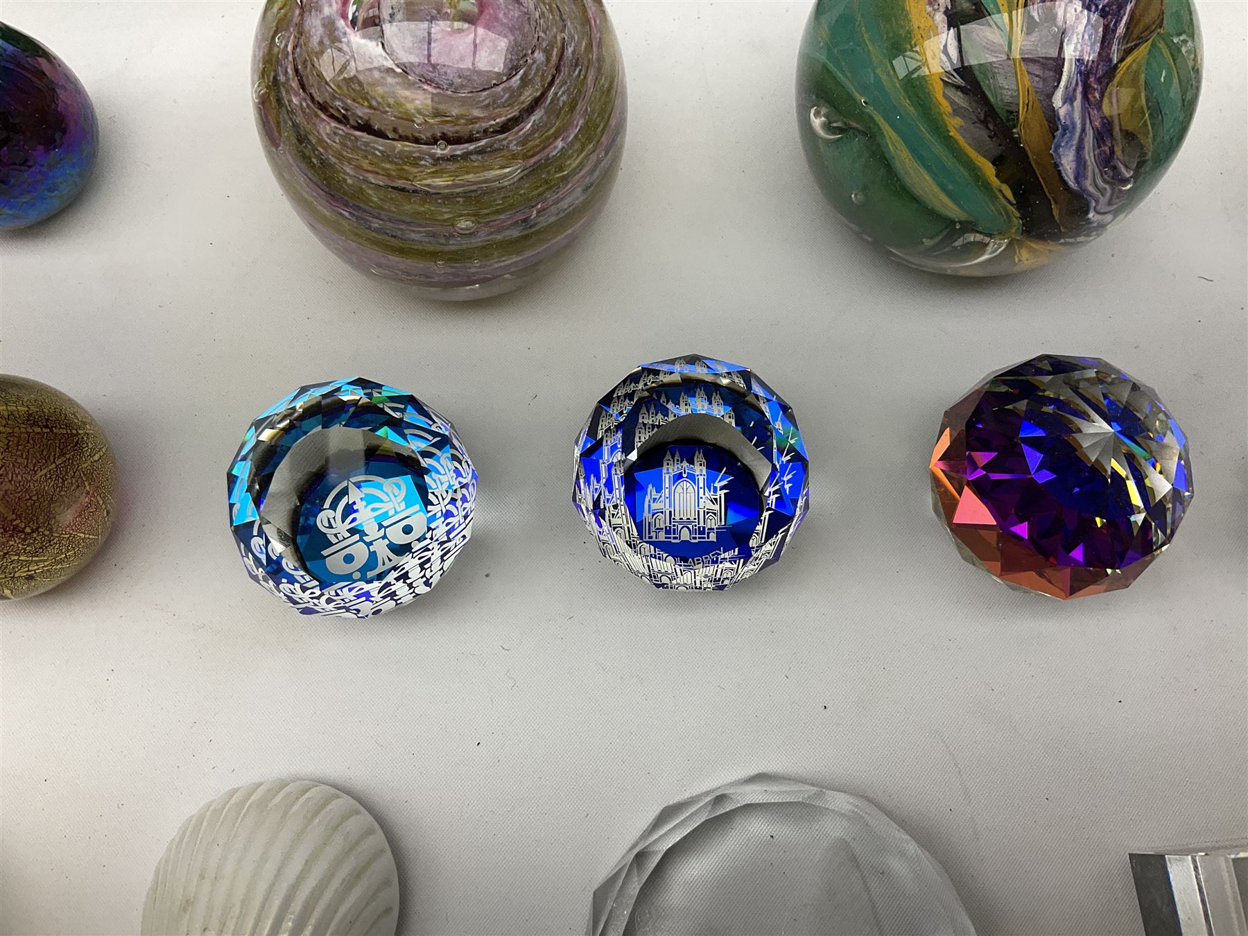 Collection of glass paperweights to include three Wedgwood examples modelled as birds, two Rosenthal faceted examples, a millefiori example, together with art glass examples to include Eirian swirled teardrop and another teardrop shaped paperweight by Caithness