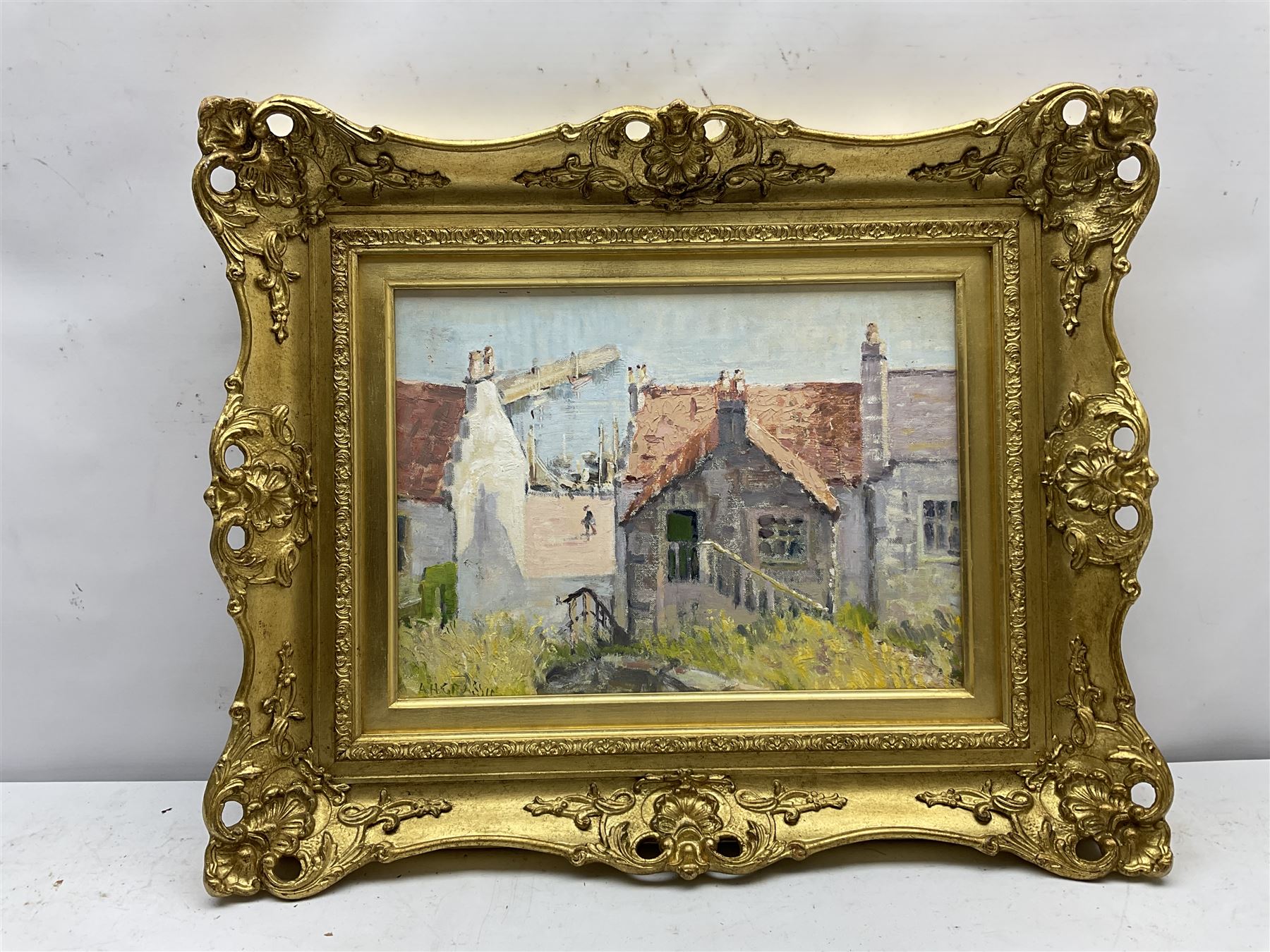 Adam H Grassie (Scottish 20th century): 'Red Roofs Fife', oil on board signed, titled verso with artist's address '90 Sandy Road Renfrew' 28cm x 39cm