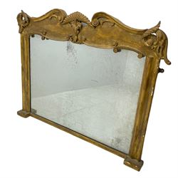 Victorian carved giltwood overmantel mirror, the pediment decorated with carved scrolling foliage mounts, moulded upright frame enclosing plain mirror plate