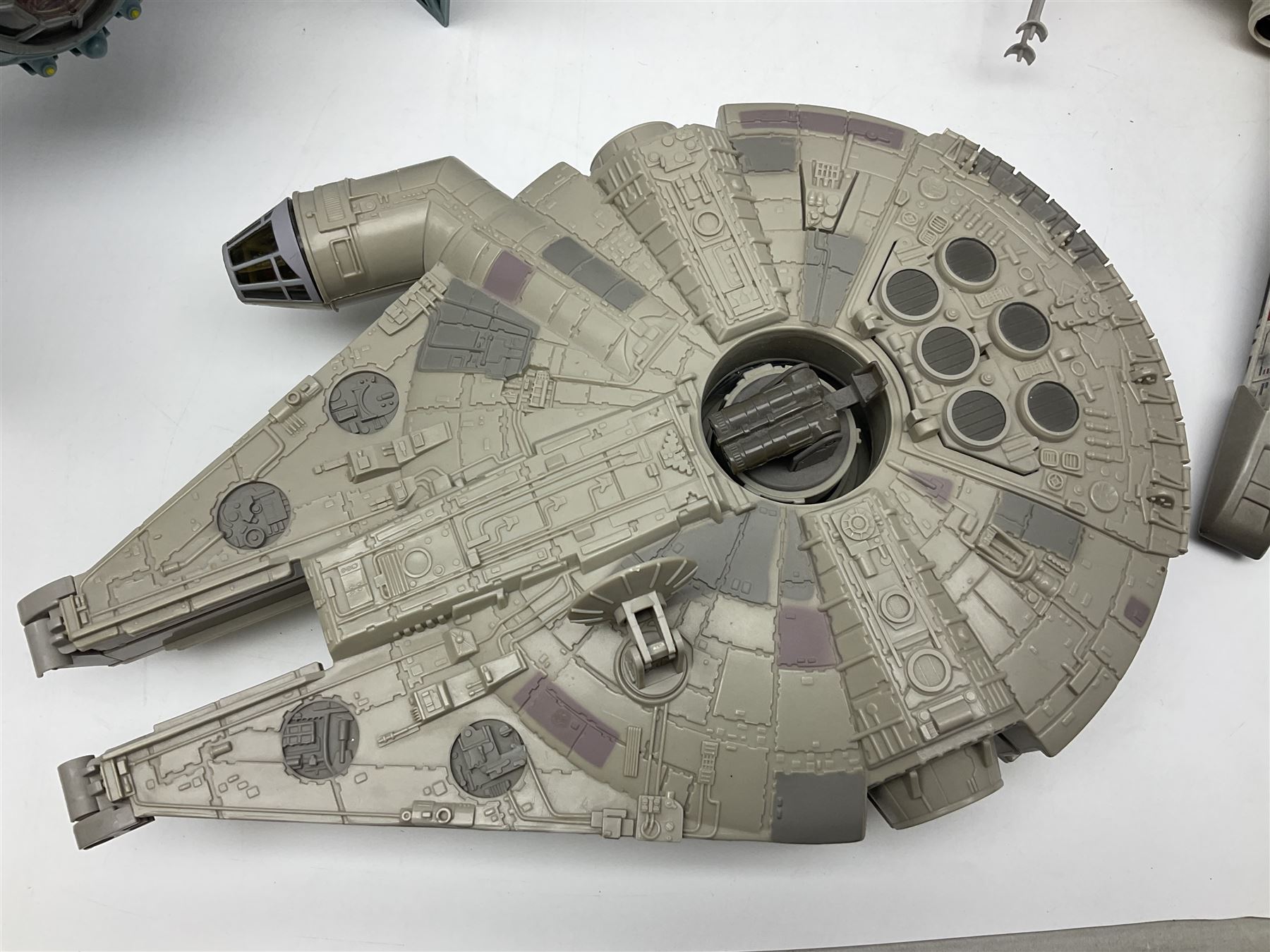 Star Wars - four space/land vehicles comprising Millenium Falcon with hinged top and figures; TIE Fighter; X-Wing Fighter with pilot; and AT-ST 'Chicken Walker' transporter; all unboxed (4)