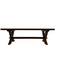 Oak rectangular extending dining table, raised on an X-frame base united by single stretcher, with two additional leaves