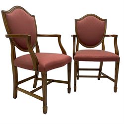 Set of six Hepplewhite design mahogany dining carver chairs, shield back within moulded frame, upholstered in pale red fabric decorated with fleur-de-lis motifs, on moulded square tapering supports with spade feet, united by plain stretchers 