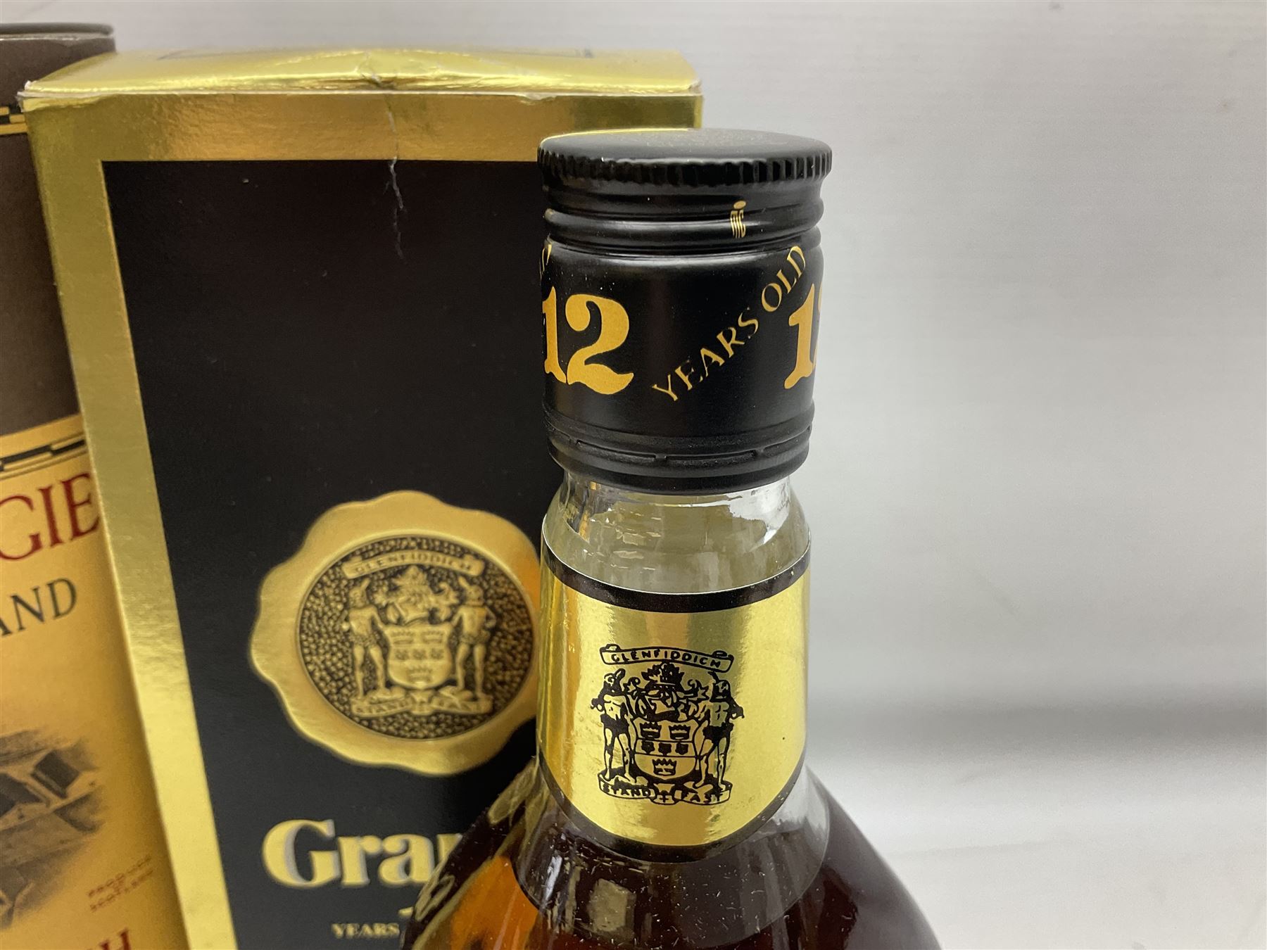 Glenmorangie, ten year old Scotch whisky, 1 litre 43% vol, Grant's twelve year old Scotch whisky 1 litre, 43 G.L and Johnnie Walker Black Label, twelve year old Scotch whisky, 1 litre 43% vol, all boxed (3)