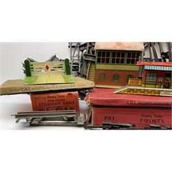 Hornby '0' gauge - layout accessories comprising PR1/PL1 Points, CR1 Right Angle Crossing and CA2 Acute Angle Crossing, all boxed; tin-plate signal box; tin-plate level crossing; textured wooden tunnel, possibly pre-WW2; and quantity of track, some boxed; together with '00' gauge tin-plate station