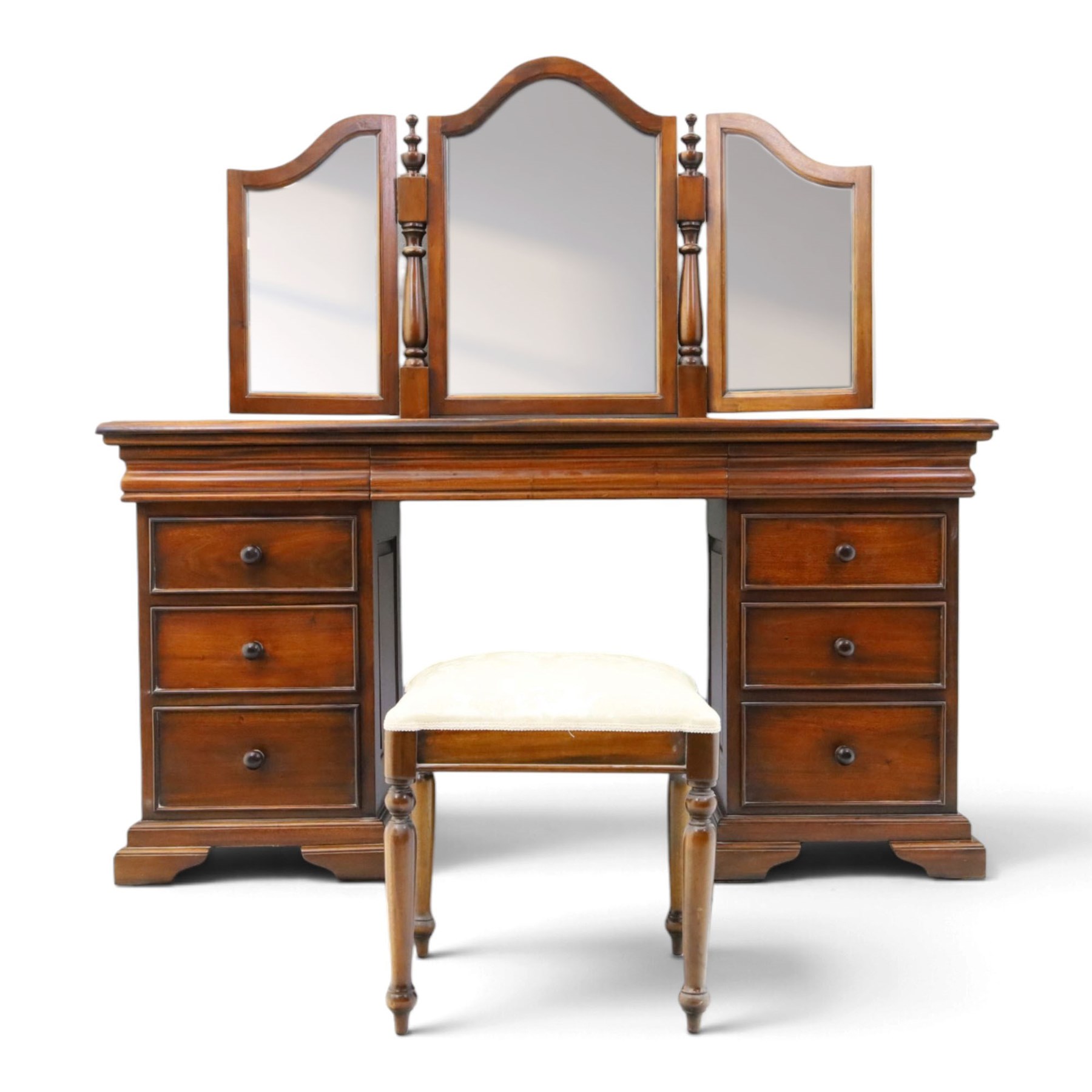 Willis & Gambier - cherrywood dressing table with mirror and stool, three-part mirror on turned uprights with finials, rectangular top above three cushion-moulded frieze drawers, twin pedestals each fitted with three graduated drawers, panelled sides and stepped plinth bases, stool with turned supports and padded seat