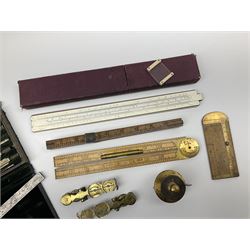 Two Victorian brass sovereign scales, one marked 'Harrison' L10cm; cased set of drawing instruments by G. Thornton Limited Manchester; Chesterman No.770/1 steel vernier caliper; two boxwood rulers; cased slide rule; brass and boxwood rope/wire gauge etc