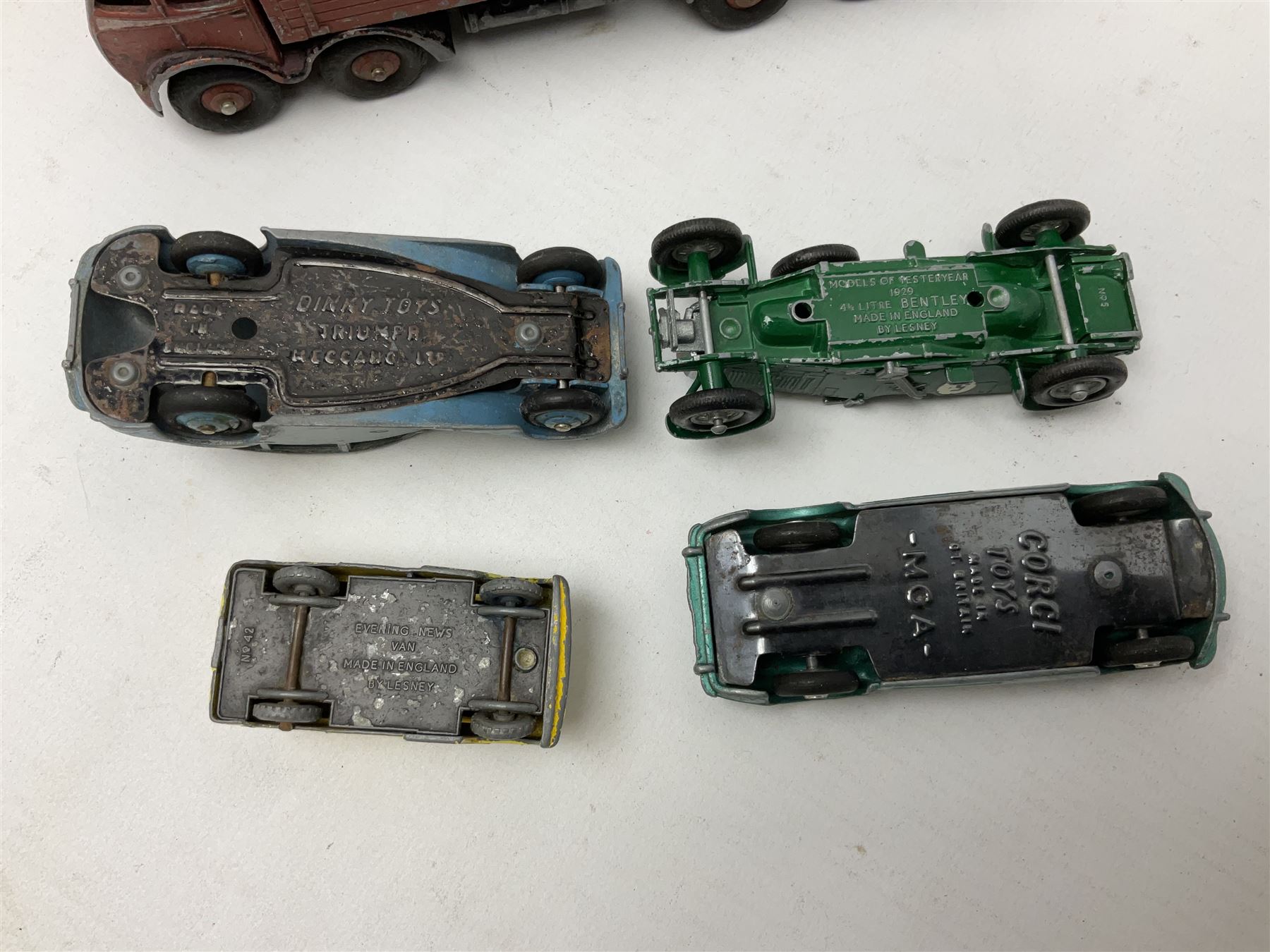 Dinky - sixteen unboxed and playworn die-cast models including Foden lorry, Big Bedford lorry with Halesowen Farm Trailer, Thunderbolt land speed record car, Spirit of the Wind racing car, market garden truck, Bedford tipper, station wagon, tanker, motorcycle combination etc; two Corgi models; and five Matchbox/Lesney models (23)