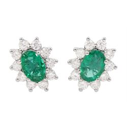 Pair of 18ct white gold oval cut emerald and round brilliant cut diamond stud earrings, total emerald weight approx 1.45 carat, total diamond weight approx 0.75 carat