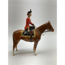 A Beswick model of HM Queen Elizabeth II mounted on Imperial Trooping the colour 1957, model no 1546, H26.5cm.