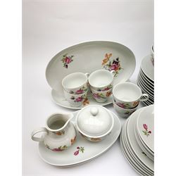 JLmenau German tea and dinner wares, comprising twelve dinner plates, seventeen side plates, twelve bowls, four large serving bowls, pair of oval serving platters, pair of smaller examples, two coffee pots, eleven teacups, twelve saucers, two milk jugs, two larger jugs, and two lidded sucriers. 