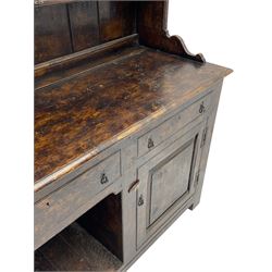 Bylaws of Leominster - 18th century design figured oak dog kennel dresser, the raised plate rack with projecting cornice over hooks and three tiers, moulded rectangular top over three drawers and two panelled cupboards, moulded frame and panelled sides, on stile supports
