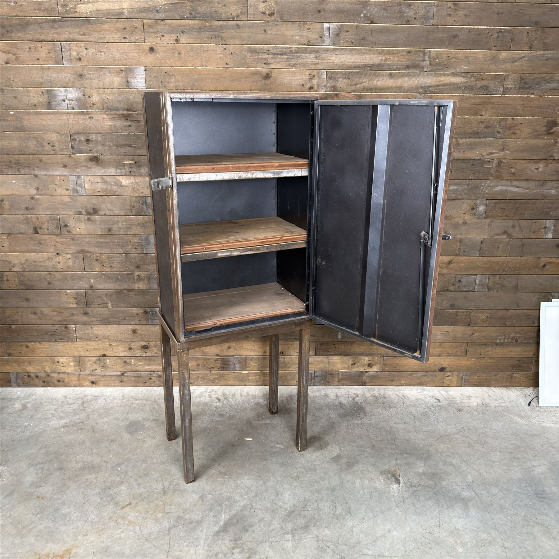 Luxor - industrial modular cabinet, three sections comprising single drawer, double drawer and single cupboard, raised on stand; and a tall industrial cabinet