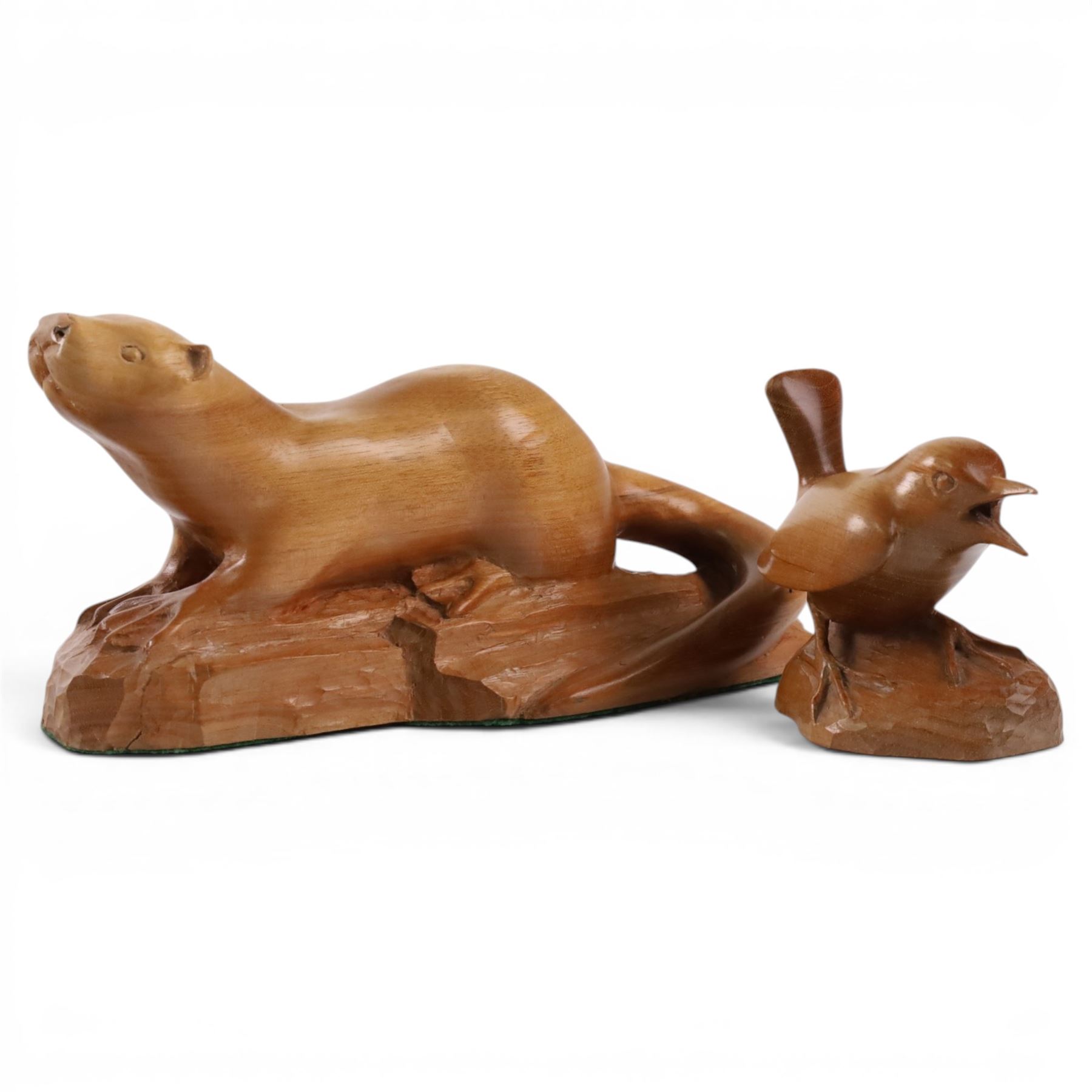 20th century walnut carvings, the first modeled as a wren, the second an otter, H  Two Yorkshire style walnut carvings, of a wren and otter, otter H10cm