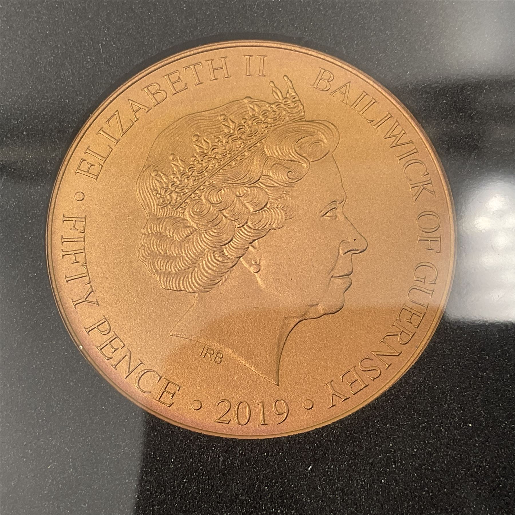 Queen Elizabeth II Bailiwick of Guernsey 2019 'The Titanium Moonlanding' fifty pence three coin set, comprising 'Green', 'Orange' and 'Blue' titanium coins, in capsules and case with certificate