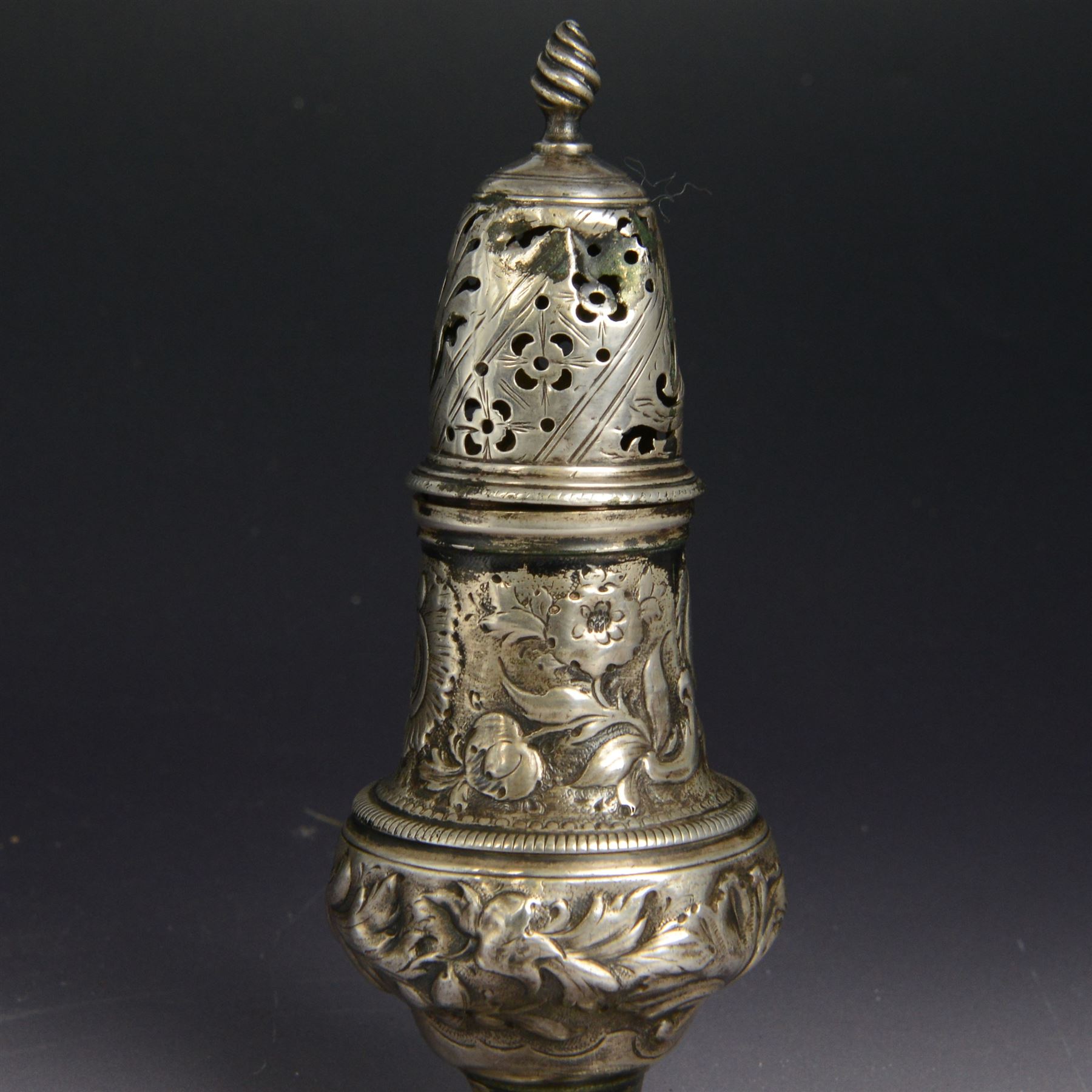 George III silver sugar caster, of typical form profusely embossed with floral and foliate details, hallmarked Jabez Daniell & James Mince, London 1768, H15cm