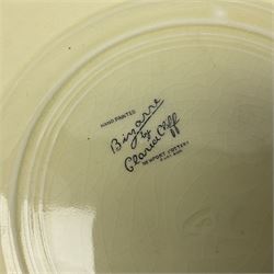 Clarice Cliff Bizarre for Newport Pottery Orange Roof Cottage pattern plate, circa 1932, hand painted with a stylised cottage and bridge landscape with yellow, orange and black banding, black printed mark beneath, D22cm 