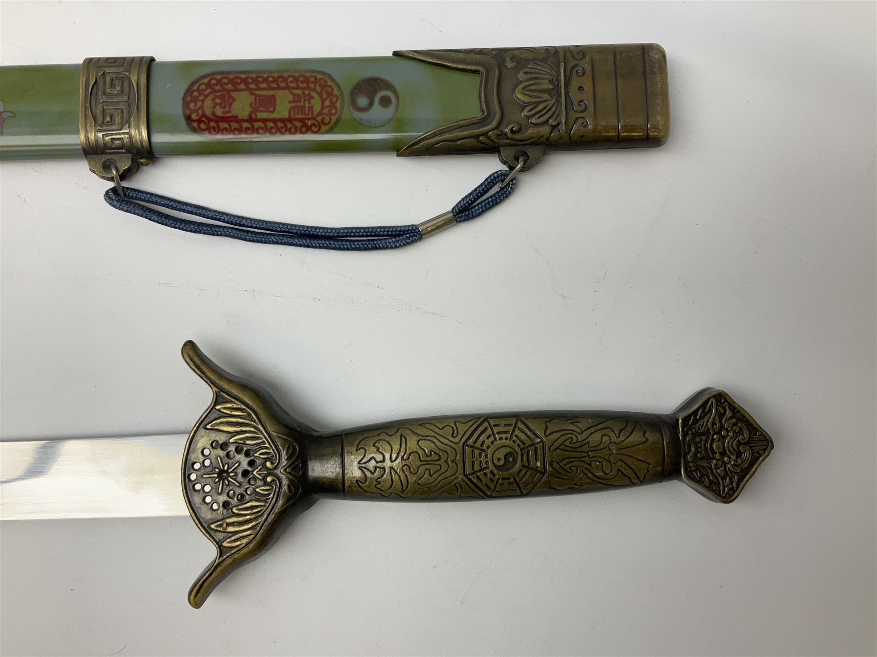 Three reproduction swords - Japanese katana and saya; Tai Chi sword with ornate scabbard; and dress sword with fullered triangular blade and horn handle (3)