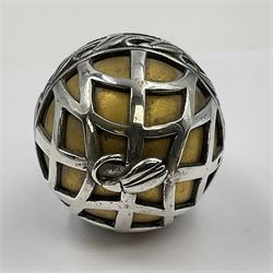 Modern silver limited edition Easter egg, no. 70/500, the gilded body decorated in relief with silver latticework and a band of flower heads, the detachable cover opening to reveal a gilt interior, each hallmarked St James House Company, London 1978, H5.5cm