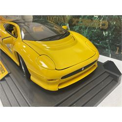 Two Maisto 1:12 scale Jaguar XJ220 ‘Racing’ cars in yellow, both on plinths in original boxes 