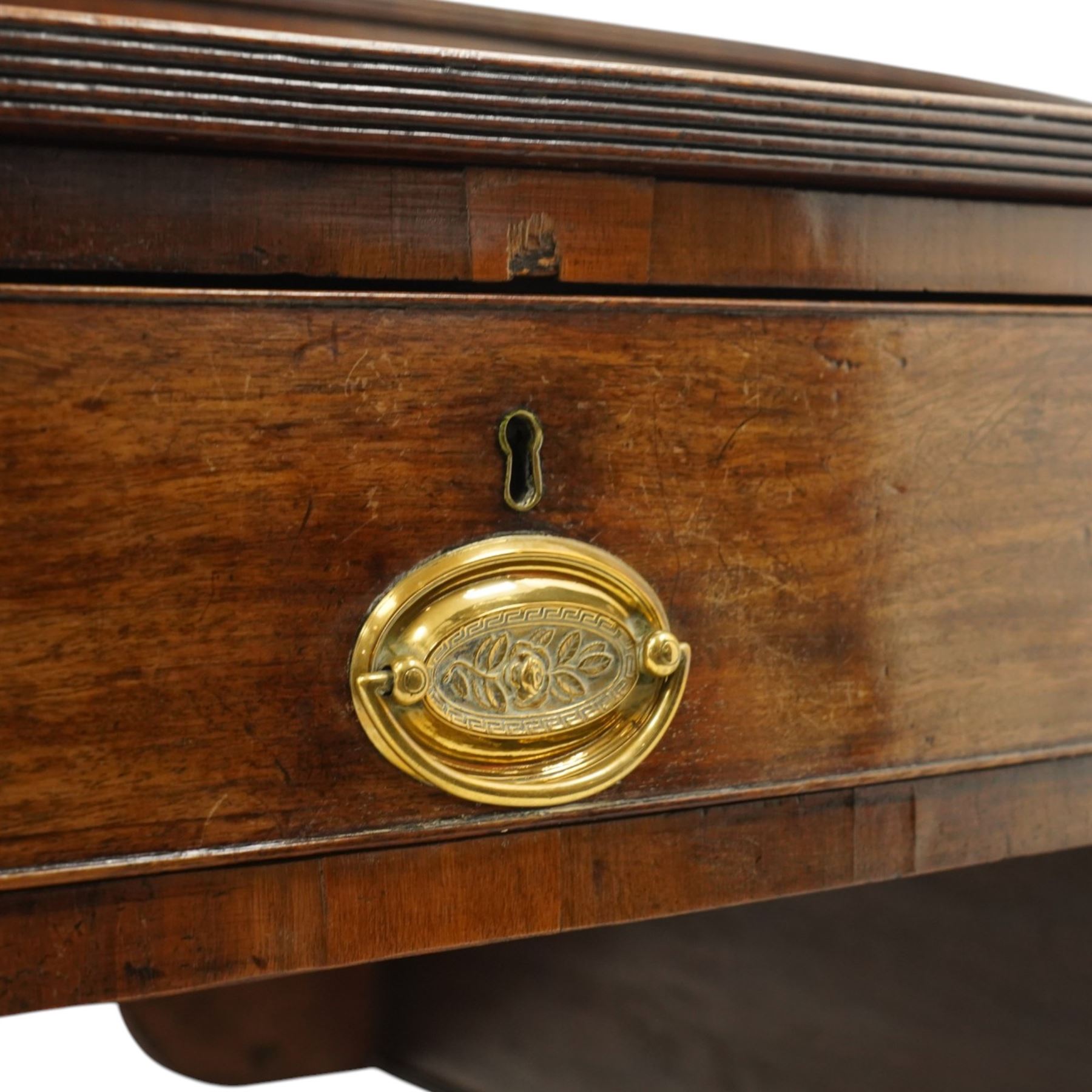Large George III mahogany bowfront sideboard, the shaped top with raised superstructure fitted with three compartments with hinged tops and reeded edge, the body fitted with two central cock-beaded frieze drawers, flanked by a cellarette drawer and hinged cupboard both with faux double drawer facias, raised on ring turned tapering supports
Provenance: Kirkham Hall