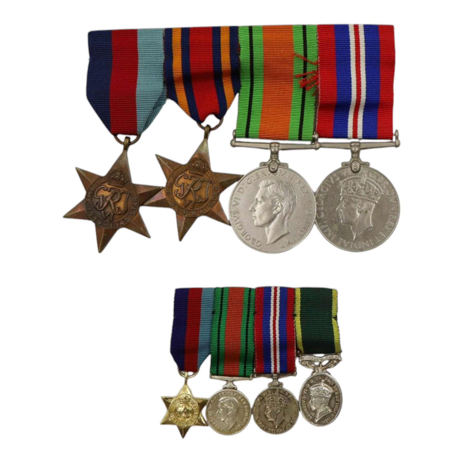 WWII British medal group comprising 1939-45 star, Burma Star, war medal and defence medal on a single bar, together with a set of WWII miniatures 1939-45 star, War medal, Defence medal and territorial medal 