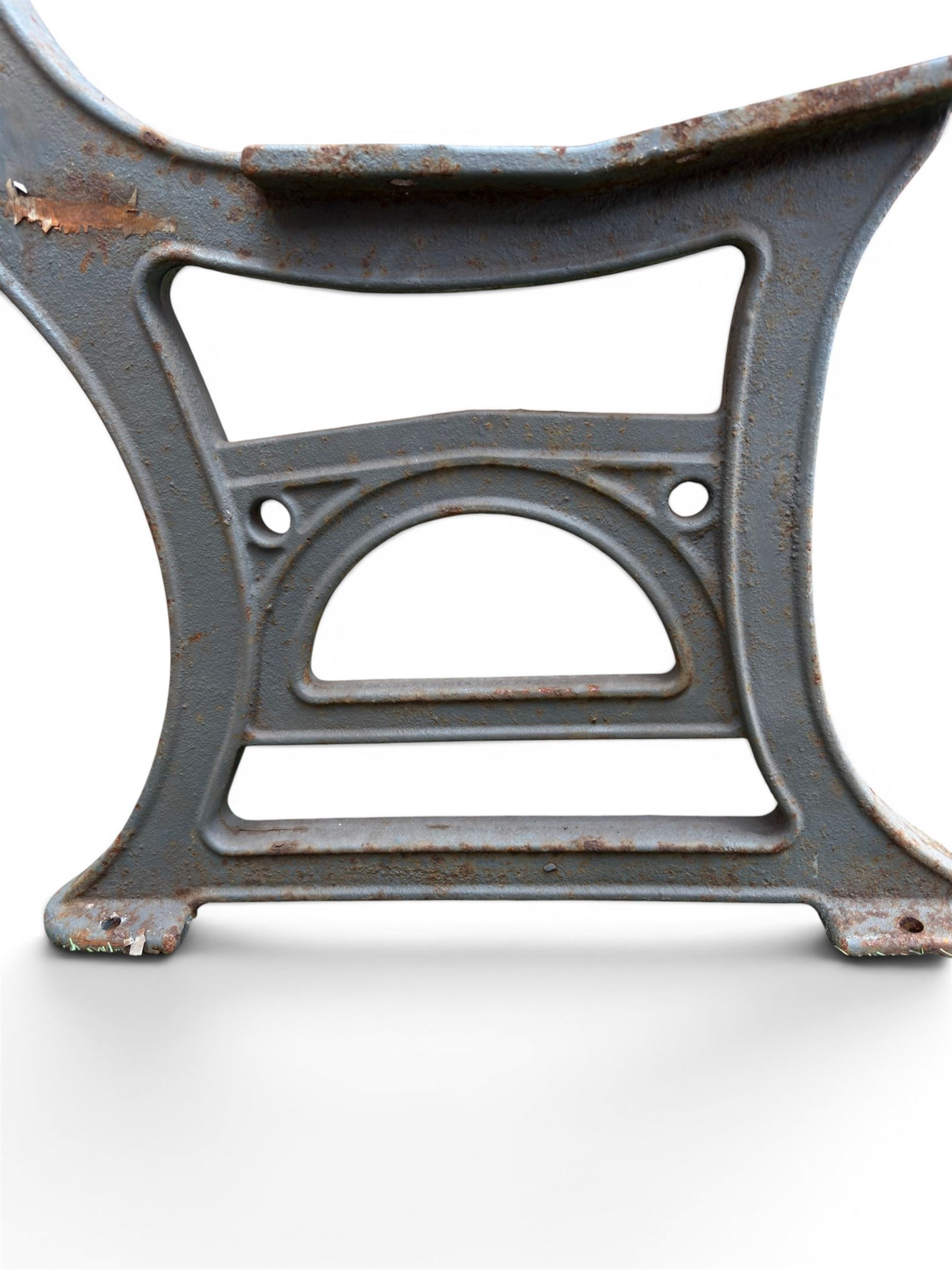 Set of three mid-20th century cast iron towns and park bench ends, scrolling pediment over arched stretchers, length to be altered as desired