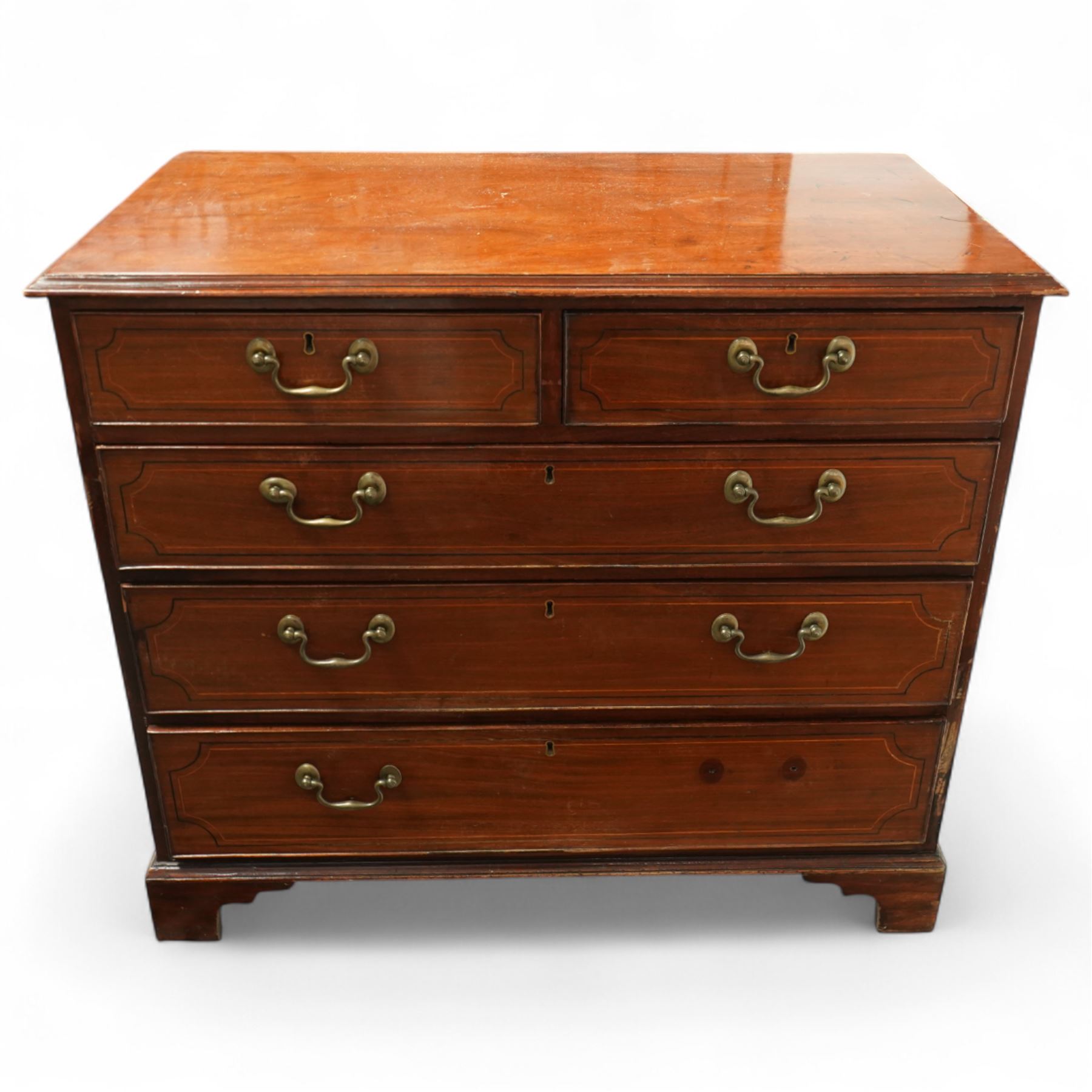 19th century mahogany chest, rectangular moulded top over two short and three long graduated drawers, each with satinwood stringing and shaped ebony inlaid panels, fitted with brass swan neck handles, raised on bracket feet