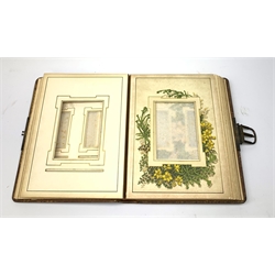 A Victorian leather bound photograph album, the majority of leaves with printed botanical detail, H29.5cm. 