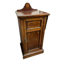 Edwardian inlaid mahogany bedside cabinet, raised back with shell inlay, the panelled cupboard door decorated with inlaid bell-flowers and satinwood stringing, on plinth base
