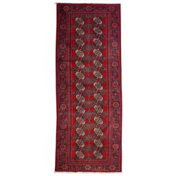 North East Persian Balochi hand-knotted runner, crimson field decorated with three vertica...
