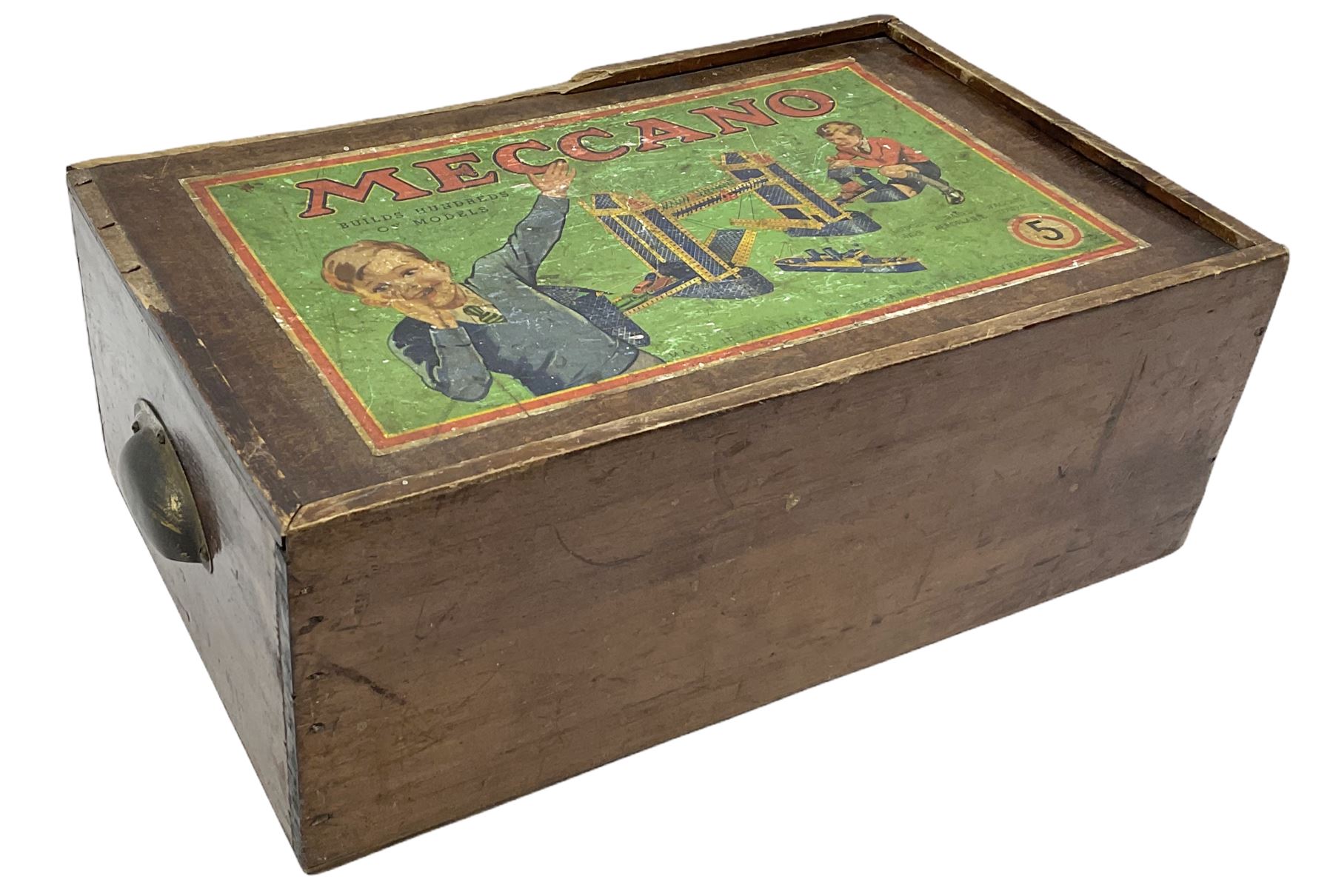 Meccano - wooden box with Set No.5 label to sliding lid, containing two lift-out trays and bottom layer of predominantly red and green sections, wheels, pulleys, rods, tyres etc, carrying handles to either end, L36cm D22.5cm H13.5cm