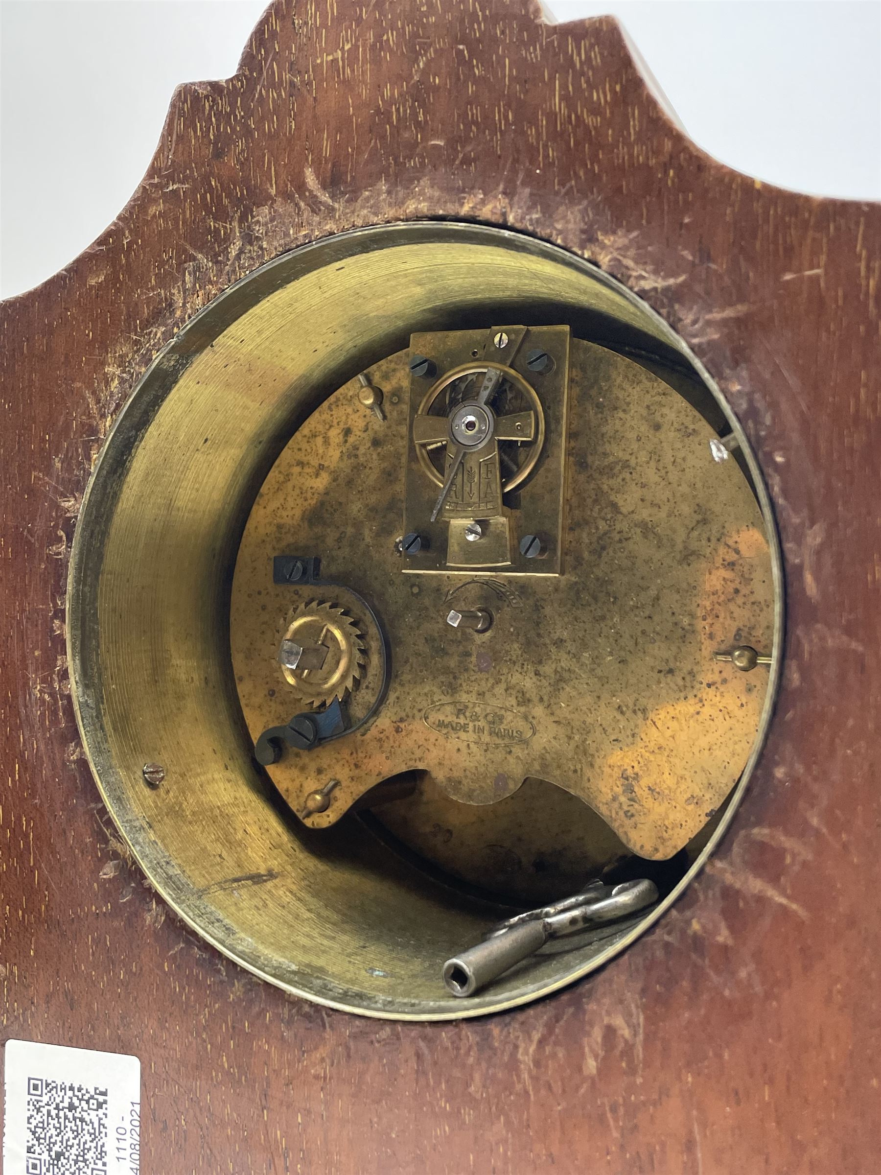 Edwardian inlaid mahogany mantel clock, stepped cavetto and arched top pediment, circular white enamel Roman dial signed 'A & J. Thompson, Scarborough', the front inlaid with fan motif, raised on globular brass feet, single train driven movement by 'R & Co. Paris'