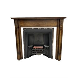 Fireplace - early 20th century oak surround with moulded mantle over turned pilasters (W145cm, H125cm, aperture - 102cm x 99cm), cast iron fire inset, electric coal effect fire, slate hearth (W148cm, D41cm), uprights and back