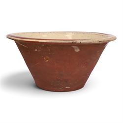 19th century pancheon, of tapering circular form, the glazed interior with slip decoration...