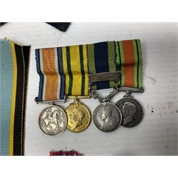 WWI group of four miniature medals comprising British War Medal, Victory Medal, India General Service Medal 1908-35 with Afghanistan NWF 1919 clasp and Territorial Force War Medal; 1939-1945 War Medal and Star; RASC and KRRC cap badges and buttons, Victorian military buttons; WWII medal slips etc
