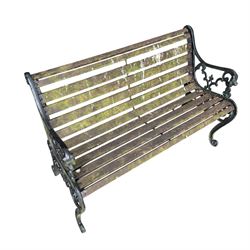 Pair of Victorian Revival Coalbrookdale design 'Dog and Serpent' pattern benches with slatted seats, the cast iron end supports of pierced and scrolling design with dog mask arm terminals