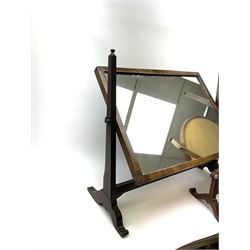 An Edwardian mahogany dressing table mirror, the oval mirror plate in swing frame, upon flared legs linked by stretcher, the frame detailed with turned roundels, H49cm, together with a Victorian mahogany example, H50cm. 