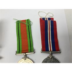 WWI pair of medals comprising British War Medal and Victory Medal awarded to 32682 Pte. W. Meadows W. Rid. R. in issue box; WWI pair of medals comprising 1914-15 Star and Victory Medal awarded to 3720 Pte. (later Cpl.) E. Petty W. York. R. with issue letter from Tank Corps; WWII group of five medals comprising 1939-45 War Medal, Defence Medal and 1939-45, Italy and Africa Stars; all with ribbons; and book of nineteen seaman's Certificates of Discharge to cook Charles Filburn 1893 - 1901 from various British ports