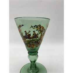 19th century bohemian green glass wine glass, the funnel bowl decorated in enamells with a Historismus hunting scene in the manner of Egermann & Lobmeyr, upon a baluster stem and circular foot, H14.5cm
