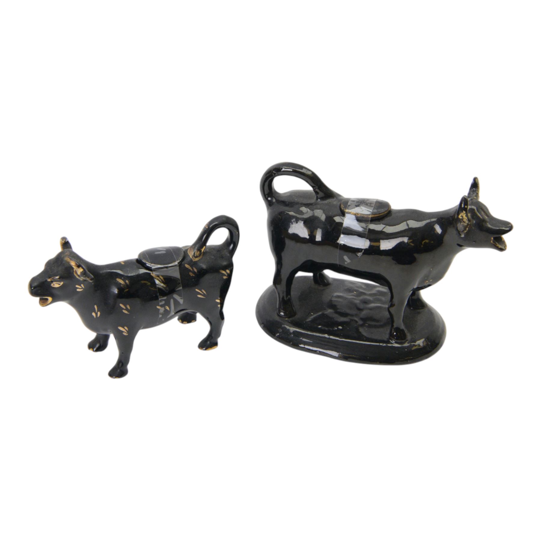 Collection of 19th century and later cow creamers, including three black glaze examples, two mottled brown examples etc  