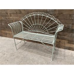 Wrought metal two seat garden bench, sunburst back, painted in pale green finish