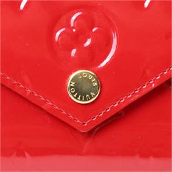 Louis Vuitton - ‘Lucy’ pochette in Cerise red Monogram Vernis leather, the structured envelope-form body with gold-tone press-stud fastening, opening to a red fabric-lined interior with central zipped compartment and two gusseted open pockets, with care card, dust bag and box
