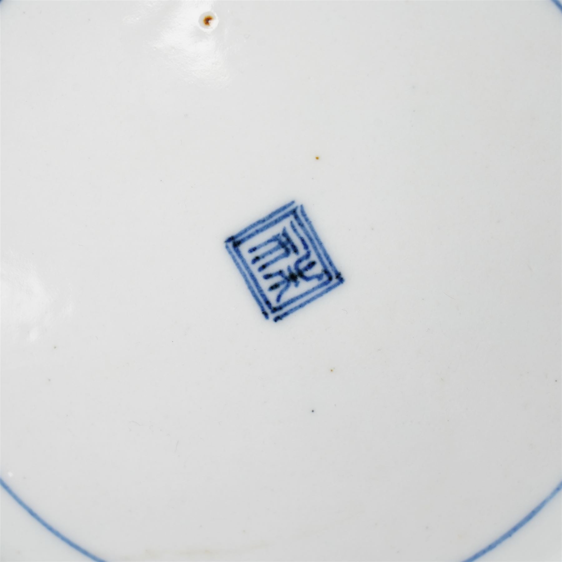 Pair of Japanese Edo period Ko Kutani dishes, decorated in green, yellow, blue iron-red, and aubergine enamels, the centres painted with a singing bird perched on a rock among foliage, within a border of alternating geometric designs and a chocolate-brown rim, the reverse with underglaze blue foliage, Fuku mark, D20.8cm (2) A matching pair of dishes is held in the collection of the Cleveland Museum of Art (see accession no. 1964.262)