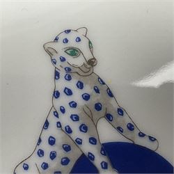 Limoges for Cartier, ceramic trinket dish, of rectangular form with rounded corners, decorated to centre with leopard upon a blue ball, with blue and gilt rim, with printed mark beneath, in original box, H15.5cm, W21cm