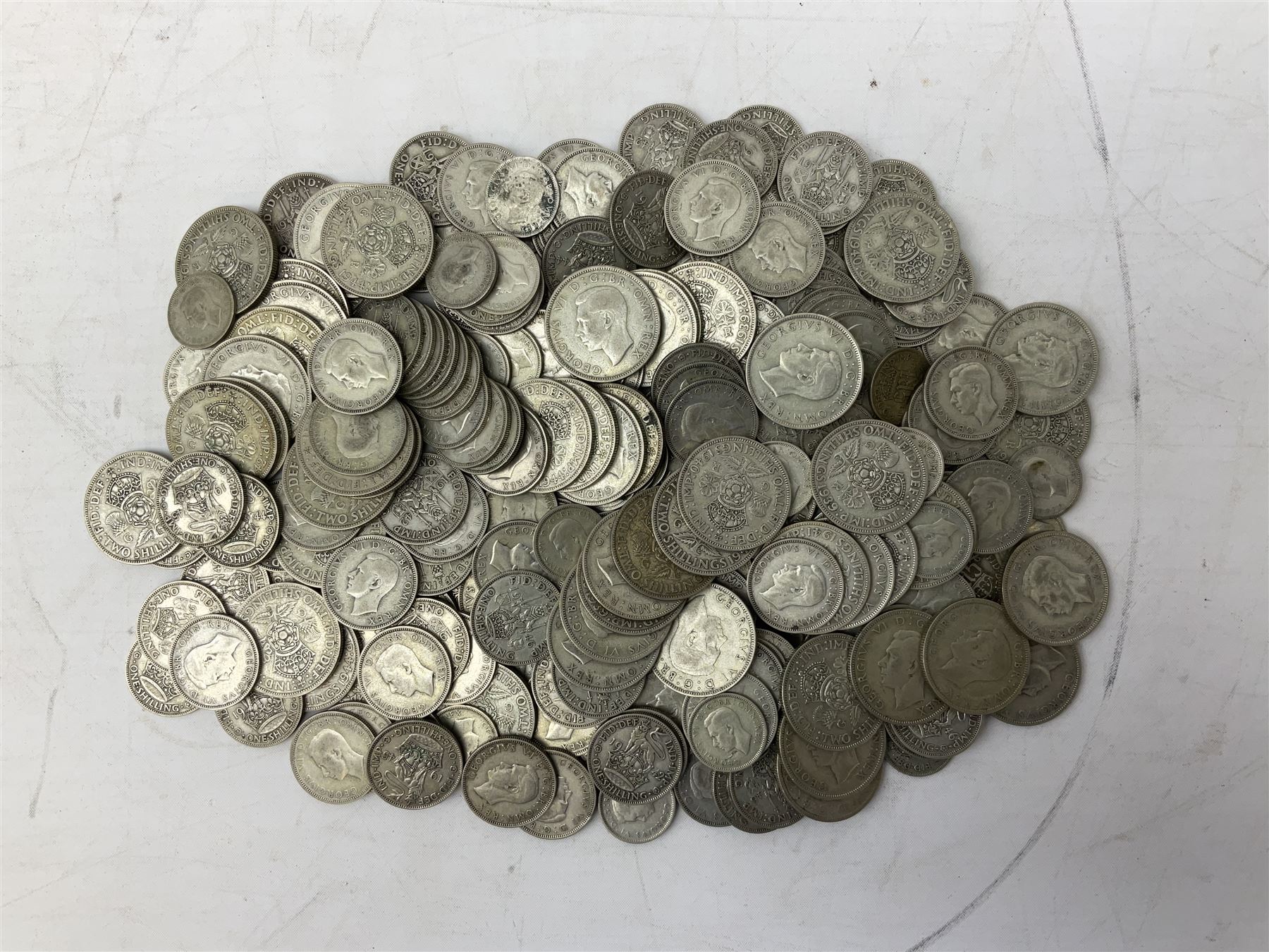 Approximately 1460 grams of pre 1947 Great British silver coins, including sixpences, shillings and two shillings 