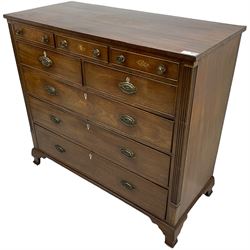 Early 19th century mahogany chest, three shallow frieze drawers over two short and three long cock-beaded drawers, canted corners with reeded moulded square columns, on ogee bracket feet
