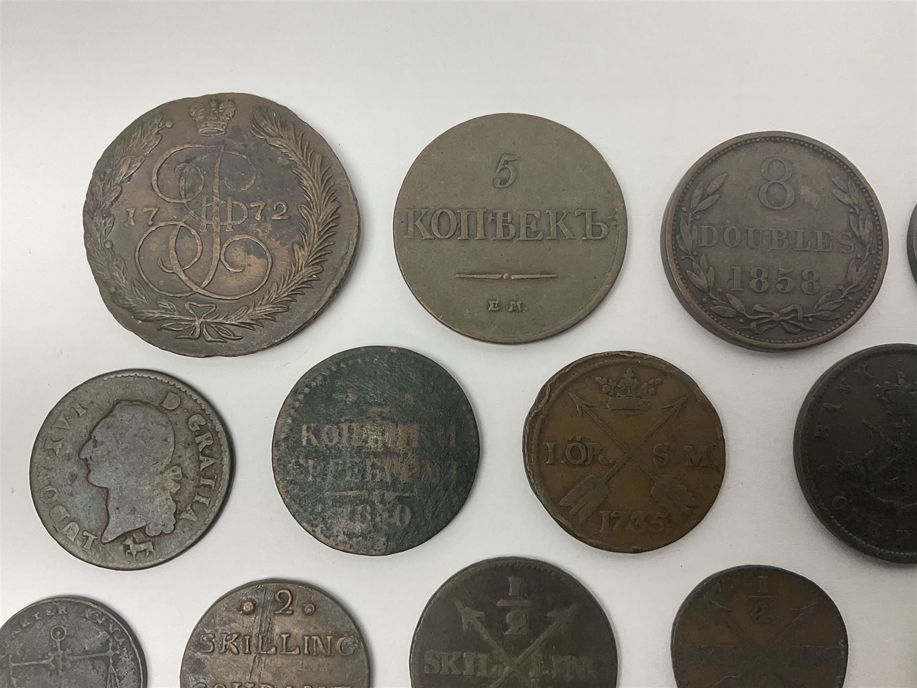 Thirty six late 18th century and onwards United Kingdom and World coins and tokens, to include 1772 Catherine II 5 Kopecks, Swedish quarter and half Skilling pieces dated 1809 and 1806, two Skilling Courant piece dated 1810, 1831 Isle of Man half penny token etc 