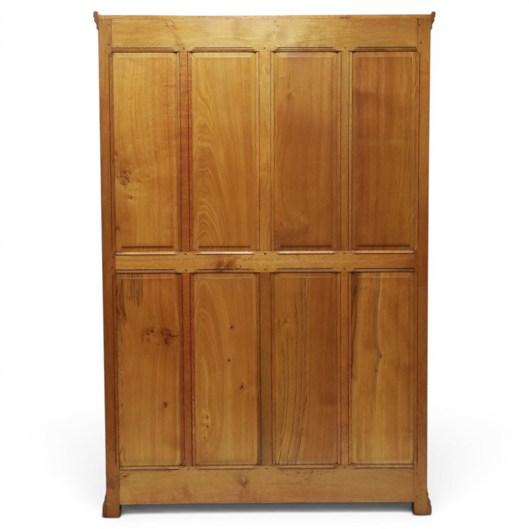 Beaverman - oak double wardrobe, enclosed by twin multi-panelled doors, Yorkshire Rose carved handles, the interior fitted with shelf and hanging rail, with signature carved beaver, by Colin Almack of Sutton, near Thirsk