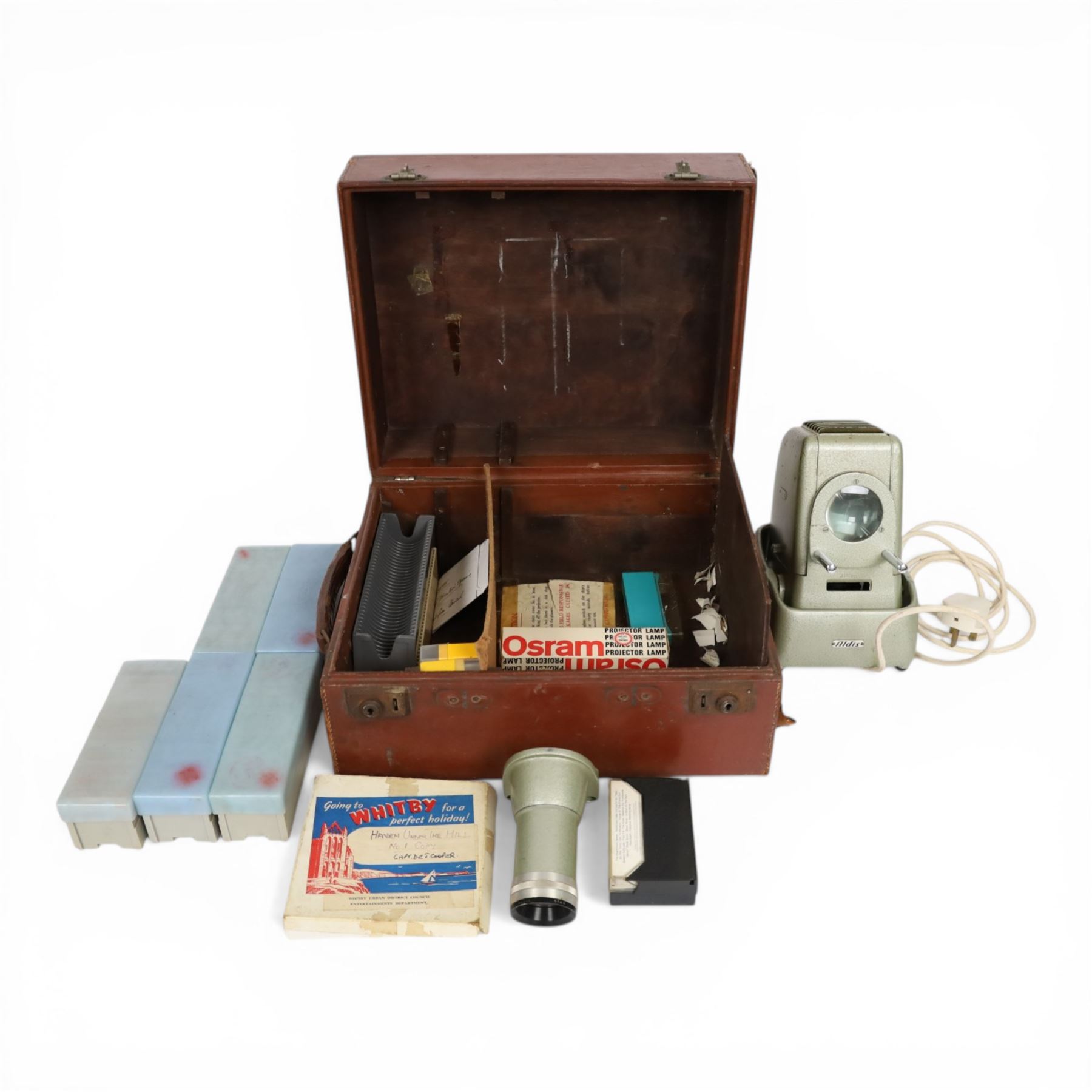 Aldis projector and a collection of local interest slides, formerly belonging to Captain Denis Cooper the Entertainments Manager Whitby for 21 years, contained within a leather carry case 